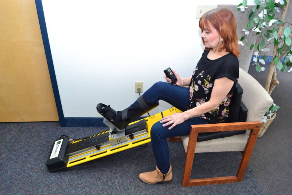 Patient using the Gener-8 rehabilitation device